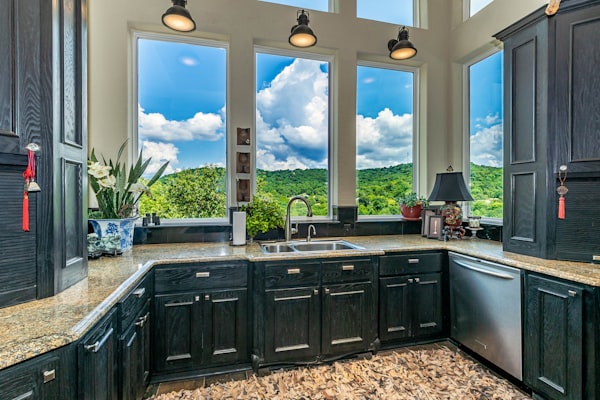 Kitchen with window and natural light showing residential plumbing context